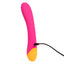 Back view of a pink and orange warming g-spot vibrator showcases its charging cord attached to the bottom base. 