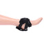 A mannequin foot wears a self-penetration strap-on harness with silicone lined straps.