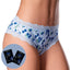 A model wears a pair of blueberry printed boy shorts with 2 x sachets of blueberry muffin flavoured lube next to her.