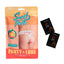 A package by Exposed lays flat on a white backdrop with a pair of crotchless peach print thongs on it next to 2 x sachets of peach flavoured lube.