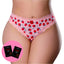 A curvy model wears a pair of crotchless strawberry print thongs with a satin bow next to 2 x sachets of strawberry flavoured lube.