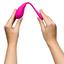 A hand model holds a pink G-Spot vibrator and showcases its flexibility. 
