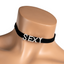 A mannequin wears a black velvet choker with the letters SEXY written in diamantés. 