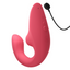 A Womanizer rose pink air clitoral g-spot vibrator showsi its charging cord and magnetic points. 