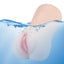 A vibrating rechargeable vagina masturbator is shown in water showcasing its waterproof design.