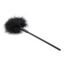 A short round faux feather tickler in black lays on a white backdrop. 