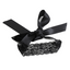 A black lace and ribbon blindfold with floral design lays against a white backdrop. 