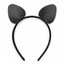 A black faux leather cat ear headband sits against a white backdrop. 