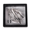 A pair of silver leaf tassel tweezer nipple clamps sits in its clear package.