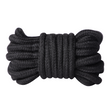 A black cotton bondage rope sits against a white backdrop. 