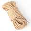 A hemp bondage rope sits against a white backdrop with silver capped ends.